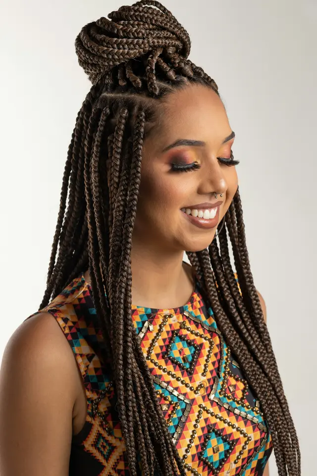 A client browsing braiders on AfroBraids
